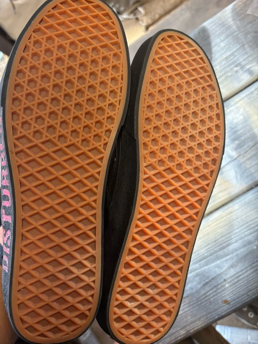 Vans black slip-on canvas sneakers with red hand-painted smiley face